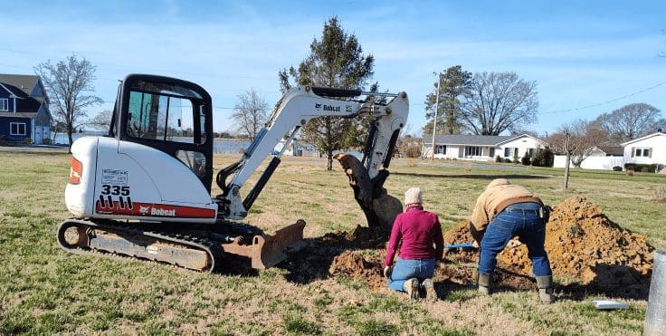 Men digging the ground